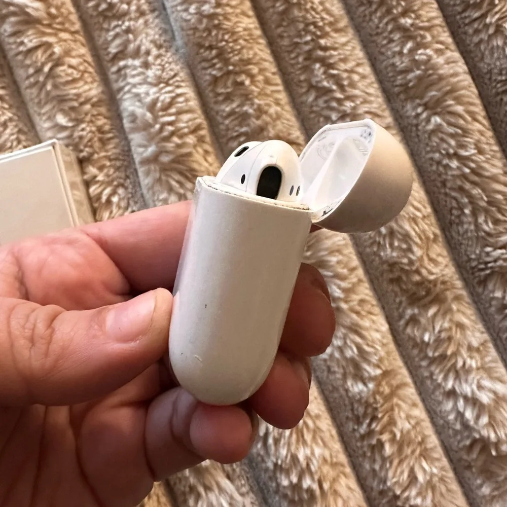 (1) brand new AirPods (1) second hand AirPods total of 2